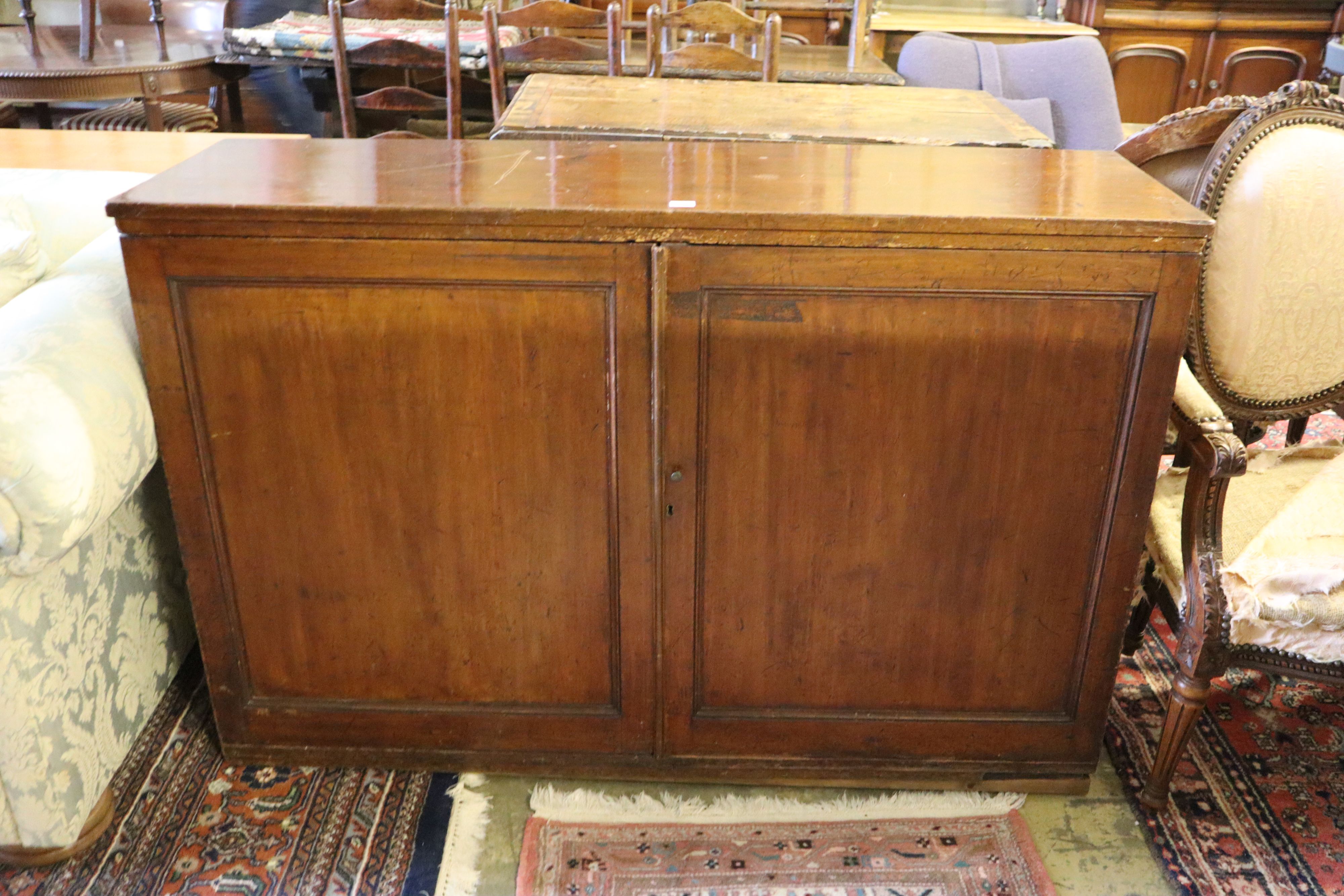 A 19th century mahogany press cupboard, width 138cm, depth 41cm, height 93cm